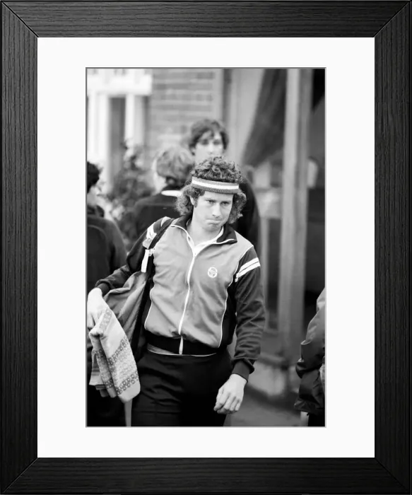 Framed Print : American tennis star John McEnroe in action at Queens Club. June 1980 Framed Print : American tennis star John McEnroe in action at Queens Club. June 1980