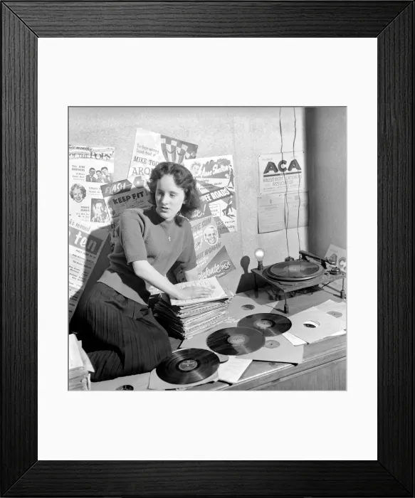 Framed Print : Kathleen Craig juke box queen who selects records for jukeboxes. 1956 A516-011 Framed Print : Kathleen Craig juke box queen who selects records for jukeboxes. 1956 A516-011