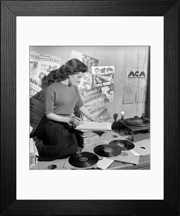 Framed Print : Kathleen Craig juke box queen who selects records for jukeboxes. 1956 A516-012 Framed Print : Kathleen Craig juke box queen who selects records for jukeboxes. 1956 A516-012