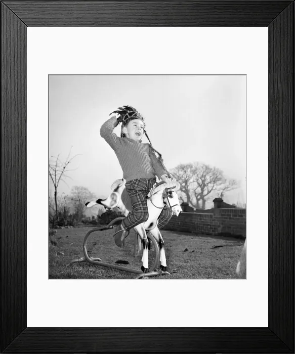 Framed Print : A boy and his best friend. Peter Hallett aged 4 seen here playing cowboys Framed Print : A boy and his best friend. Peter Hallett aged 4 seen here playing cowboys