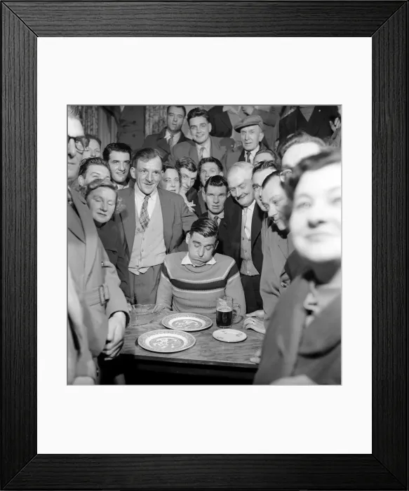 Framed Print : Miner Joe Steele seen here taking part in a food eating competition