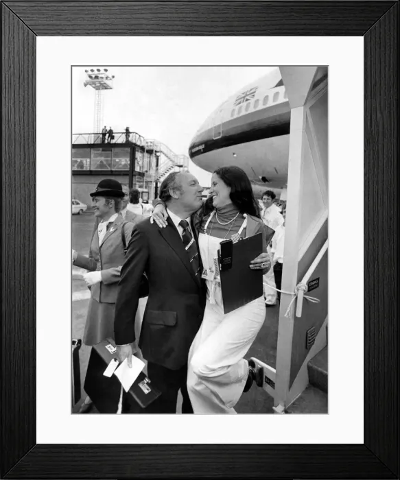 Framed Print : A cuddle for the cut-price king Freddie Laker from a Gatwick hostess Framed Print : A cuddle for the cut-price king Freddie Laker from a Gatwick hostess