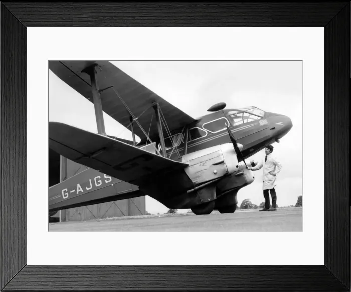 Framed Print : The old dragon prepares for its greatest test. Dragon Rapide G-AJGS being prepared for Framed Print : The old dragon prepares for its greatest test. Dragon Rapide G-AJGS being prepared for