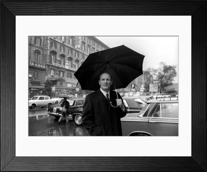 Framed Print : Henry Cooper in Italy: Henry Cooper pictured in the rain on the Via Veneto Framed Print : Henry Cooper in Italy: Henry Cooper pictured in the rain on the Via Veneto