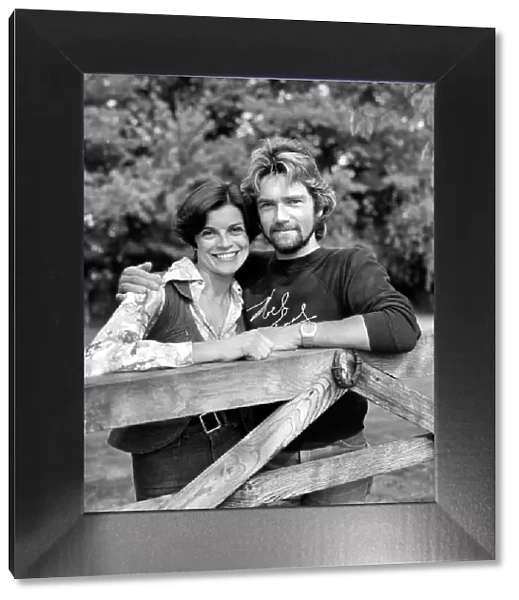Noel Edmonds and his wife at home relax in the garden. September 1976