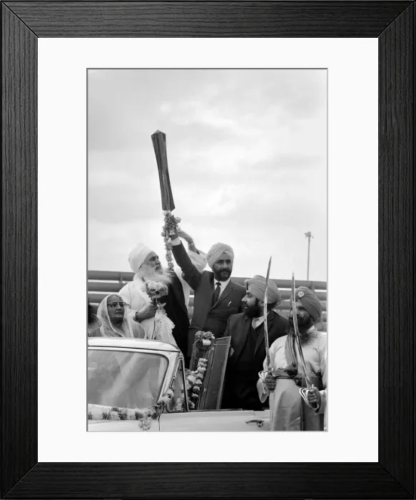Framed Print : A party of Sikhs drive around the tarmac at Heathrow airport with Sikh