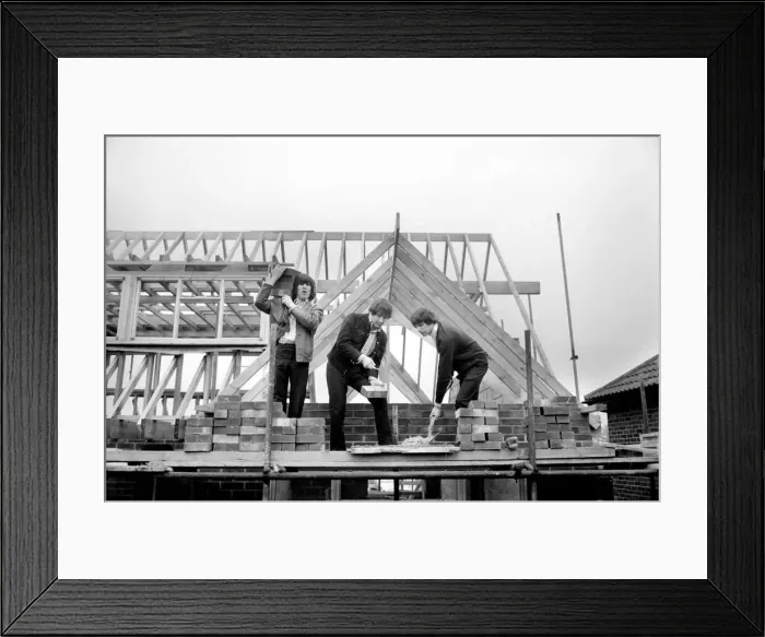 Framed Print : The Troggs, pop group help to build a house for one of their members Framed Print : The Troggs, pop group help to build a house for one of their members