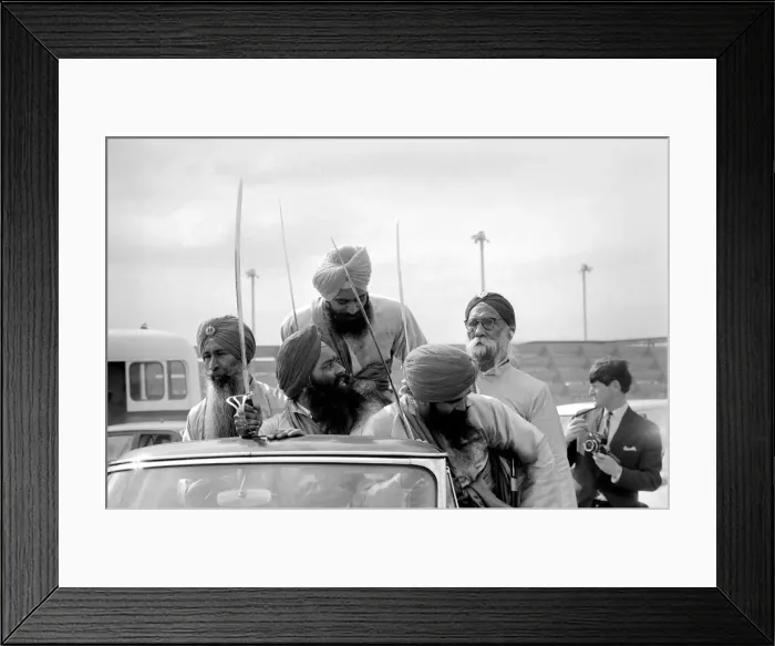 Framed Print : A party of Sikhs drive around the tarmac at Heathrow airport with Sikh Framed Print : A party of Sikhs drive around the tarmac at Heathrow airport with Sikh