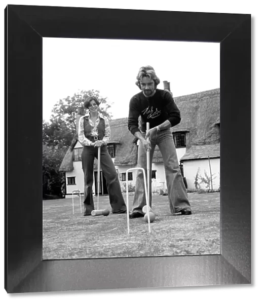 Noel Edmonds and his wife at home playing croquet in the garden. September 1976