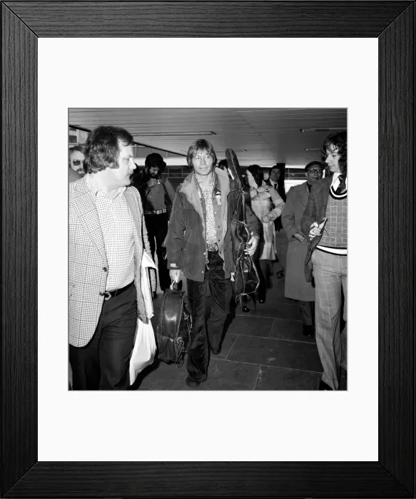 Framed Print : John Denver: U. S. singer seen here at London Airport with his guitar. April 1976 Framed Print : John Denver: U. S. singer seen here at London Airport with his guitar. April 1976