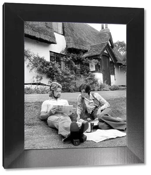 Noel Edmonds and his wife at home relax in the garden. September 1976