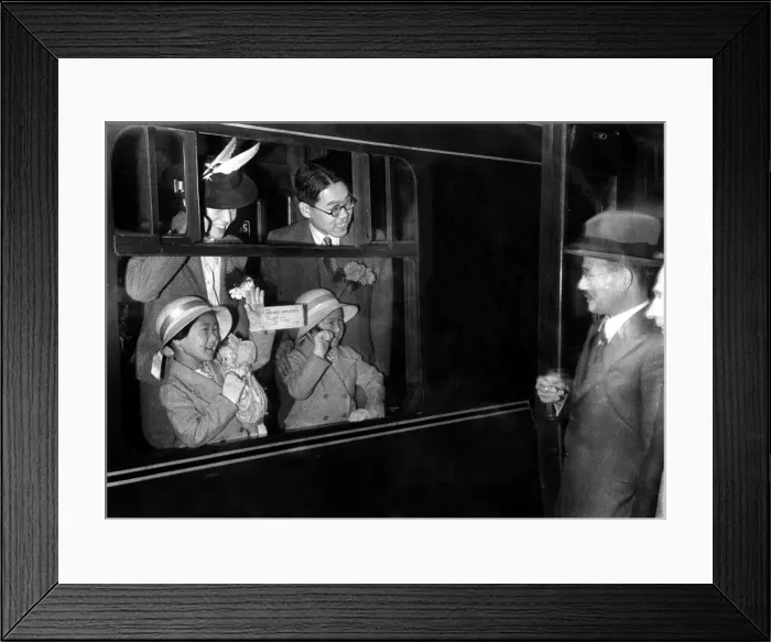 Framed Print : A Japanese family leaving Euston station to return home to Japan June 1940