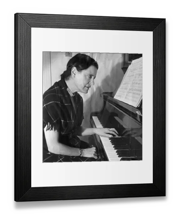 Framed Print : Concert pianist Harriet Cohen, practiicng the piano left handed after she injured her Framed Print : Concert pianist Harriet Cohen, practiicng the piano left handed after she injured her