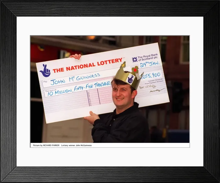 Framed Print : John McGuinness holding National Lottery cheque for £10, 055, 900 Framed Print : John McGuinness holding National Lottery cheque for £10, 055, 900