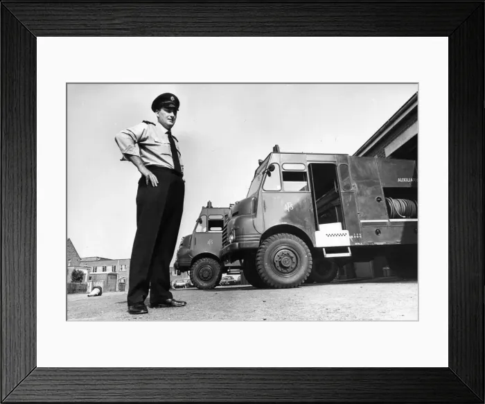 Framed Print : Fireman Jim Cairns with two of the fire appliances brought out of storage to help fight