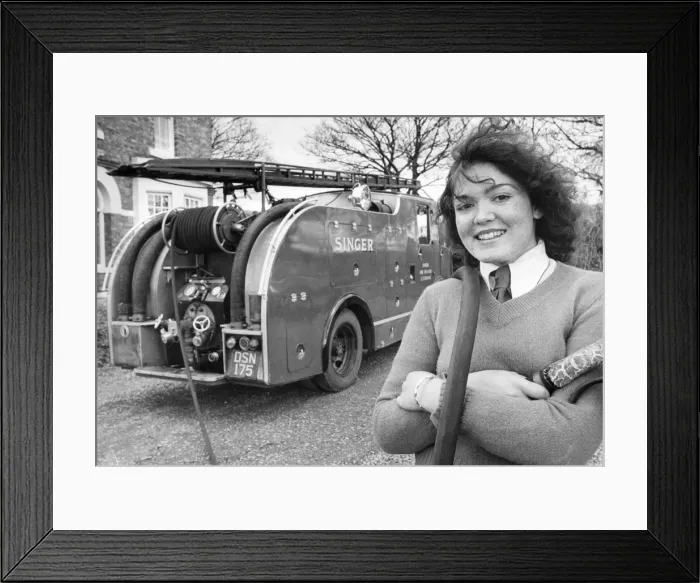 Framed Print : Gillian Baxter with the fire engine which ready for action should it be need ied in this