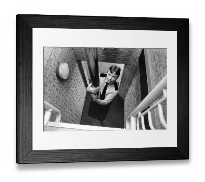Framed Print : Firefighter Tony Rochford slides down the pole at West Denton Fire Station
