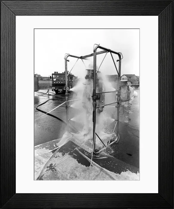 Framed Print : Firefighters are decontaminated after dealing with the chemical spillage at the scene Framed Print : Firefighters are decontaminated after dealing with the chemical spillage at the scene