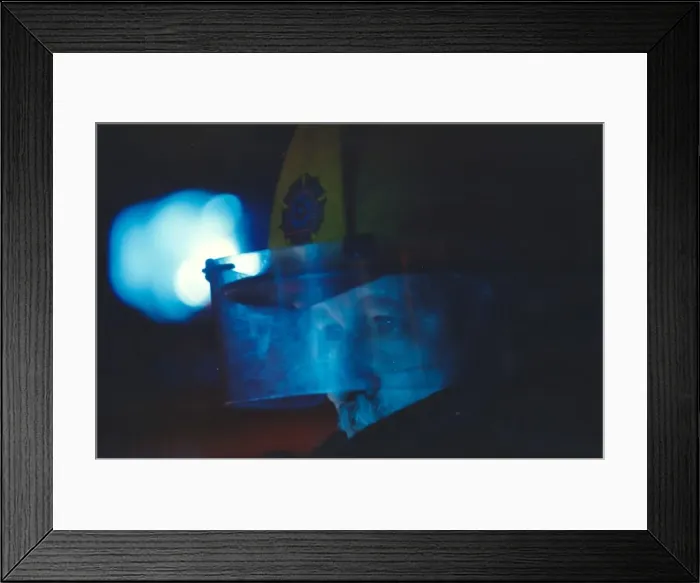 Framed Print : A firefighter all ready for acion in his helmet