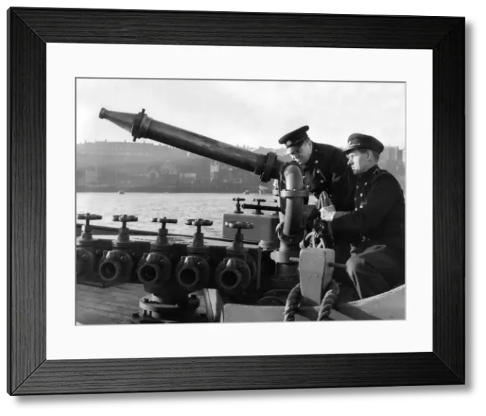 Framed Print : Some of the floating firemen demonstrating the boats water gun Framed Print : Some of the floating firemen demonstrating the boats water gun