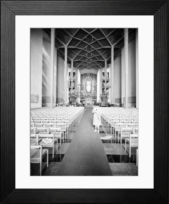 Framed Print : Craftsmen put the finishing touches to the new Coventry Cathedral which stands alongside