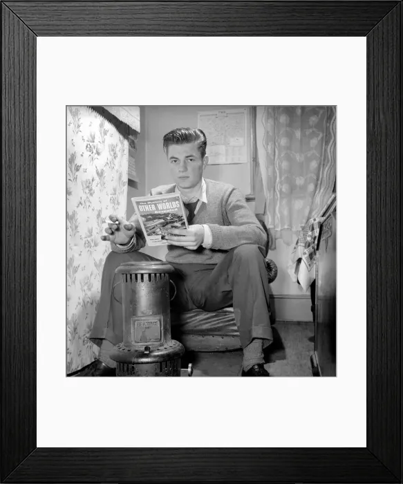 Framed Print : Teenage author Thomas Folks seen here reading science fiction stories in his bedroom Framed Print : Teenage author Thomas Folks seen here reading science fiction stories in his bedroom