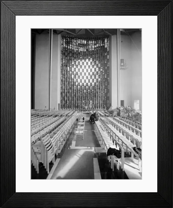 Framed Print : Craftsmen put the finishing touches to the new Coventry Cathedral which stands alongside