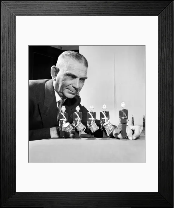 Framed Print : Toys: Man shows his display of toy figurines and soldiers. January 1954 A100-003