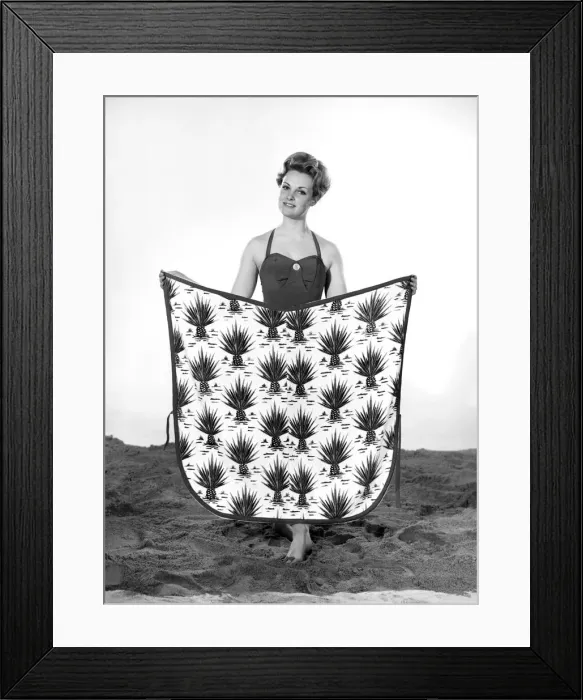 Framed Print : Model Roma Reeves wearing beach toga that doubles as a beach towel. May 1962 Framed Print : Model Roma Reeves wearing beach toga that doubles as a beach towel. May 1962