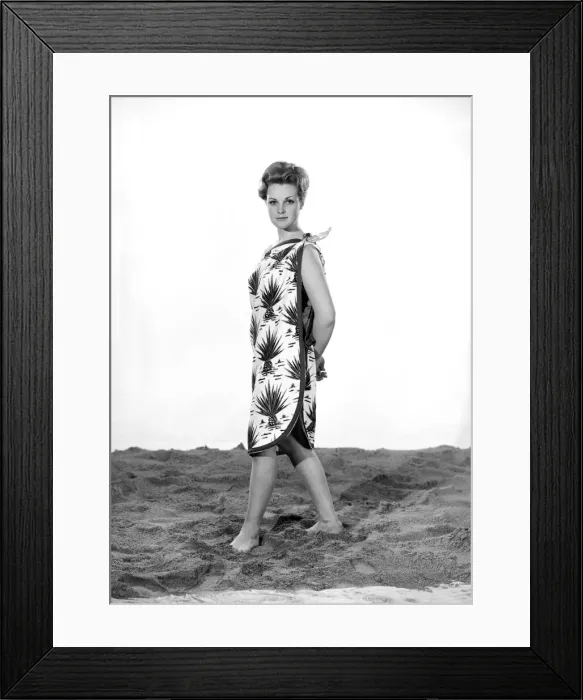 Framed Print : Model Roma Reeves wearing beach toga that doubles as a beach towel. May 1962 Framed Print : Model Roma Reeves wearing beach toga that doubles as a beach towel. May 1962