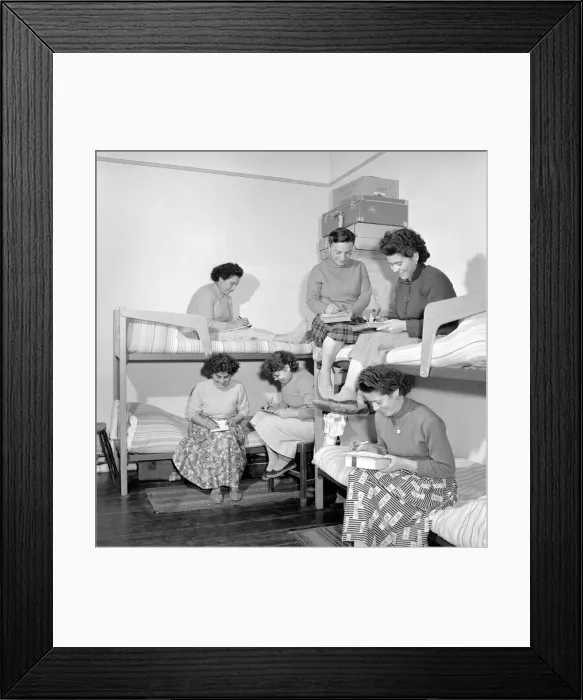 Framed Print : Women mushroom pickers from overseas seen here after work writing letters. 1963