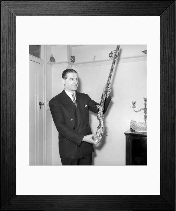 Framed Print : Pip Roberts a collector of antique firearms, seen here demonstrating a flintlock rifle Framed Print : Pip Roberts a collector of antique firearms, seen here demonstrating a flintlock rifle