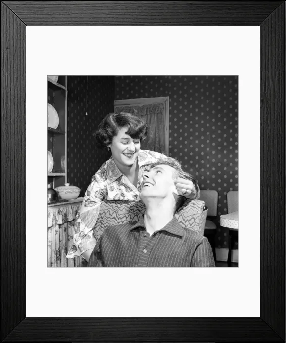 Framed Print : Mr. and Mrs. Health seen here at home discussing how he proposed marriage to her Framed Print : Mr. and Mrs. Health seen here at home discussing how he proposed marriage to her