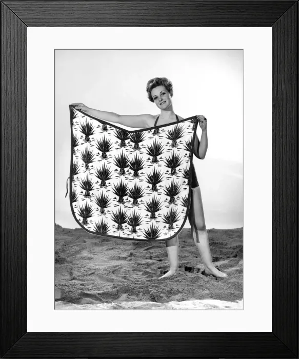 Framed Print : Model Roma Reeves wearing beach toga that doubles as a beach towel. May 1962 Framed Print : Model Roma Reeves wearing beach toga that doubles as a beach towel. May 1962