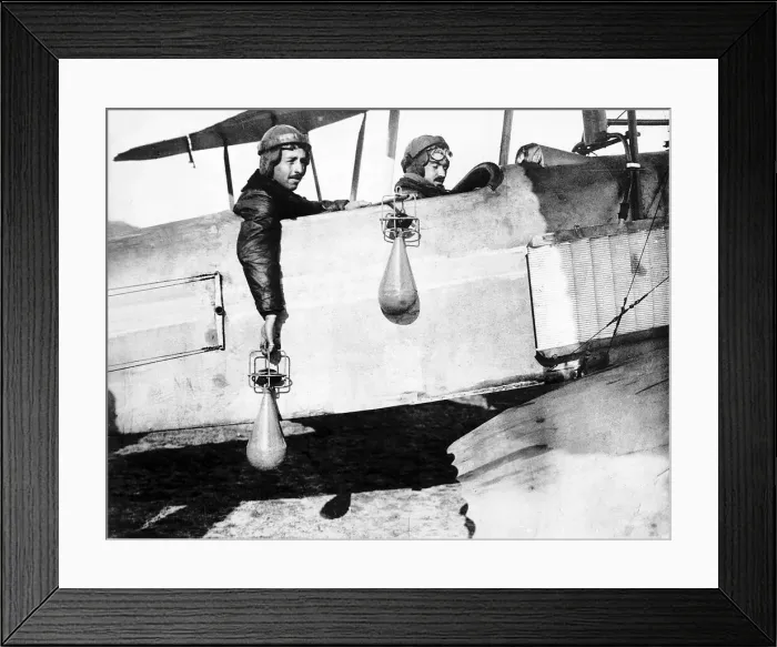 Framed Print : British airmen drop handbombs from their bi-plane. 1914 World War One Framed Print : British airmen drop handbombs from their bi-plane. 1914 World War One