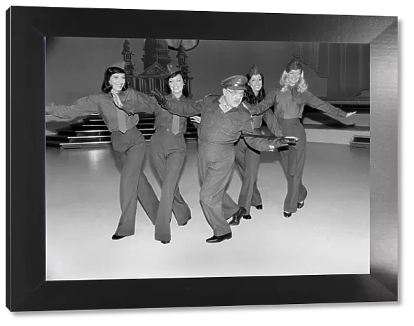 Comedy actor Arthur Lowe of Dads Army dancing with girls