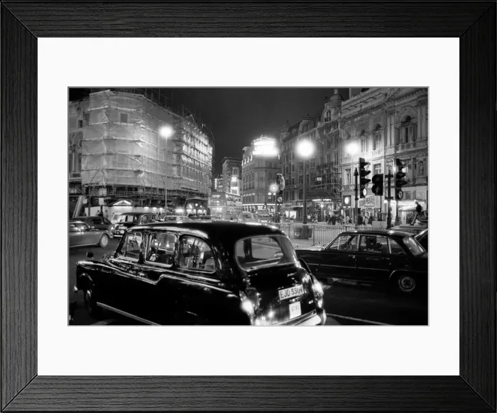 Framed Print : London taxis around Picadilly Circus at night. February 1987