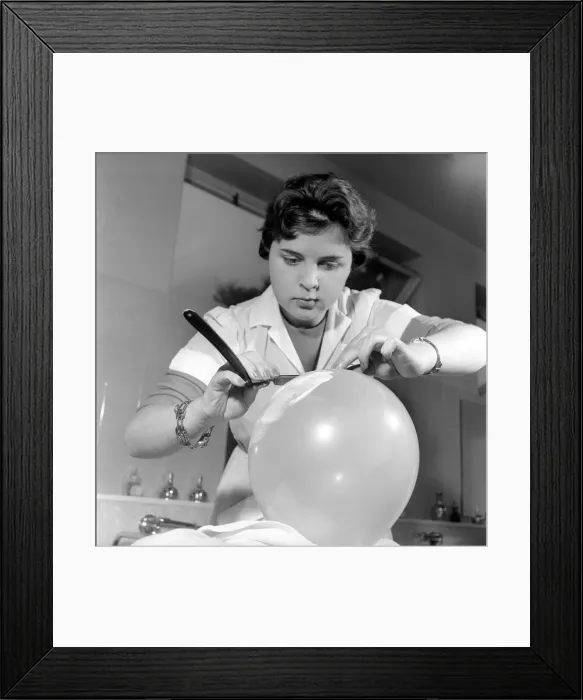Framed Print : Women barbers training with cut throat razors, learn how to shave by using balloons Framed Print : Women barbers training with cut throat razors, learn how to shave by using balloons