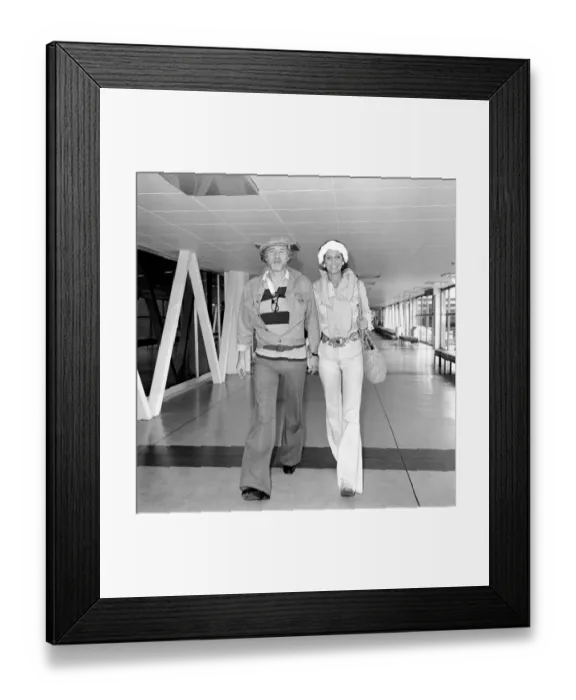 Framed Print : Richard Harris and his wife at London airport. July 1975 Framed Print : Richard Harris and his wife at London airport. July 1975