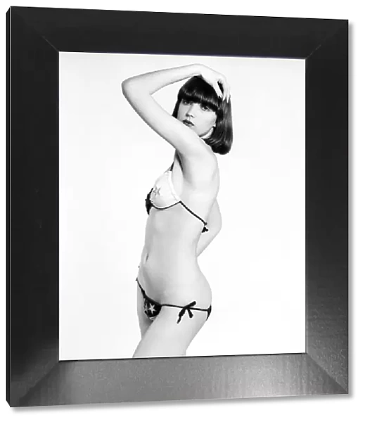 Model Marianne poses wearing a bikini in the studio. April 1975 75-1964a