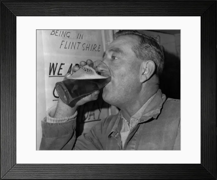 Framed Print : A man drinking a pint at his local pub after new licencing laws came into effect