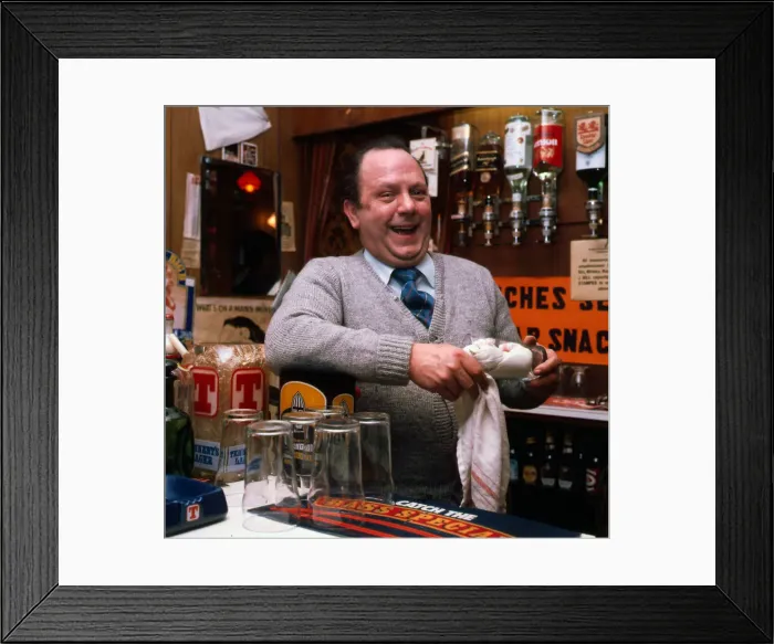 Framed Print : Eric Milligan working behind bar 1976 Framed Print : Eric Milligan working behind bar 1976