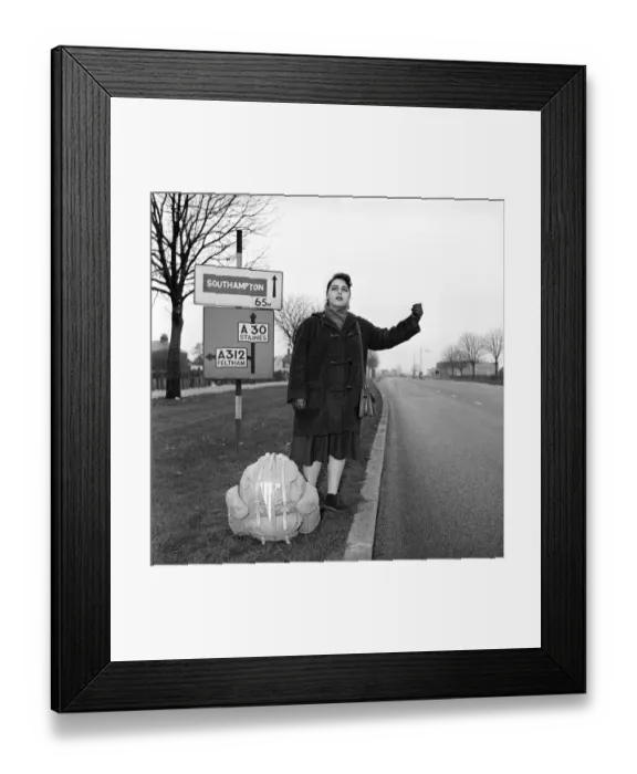Framed Print : Girl hitch-hiking on the A30. to Southampton Circa 1957
