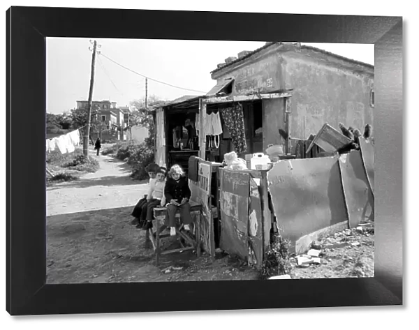 Children outside their home in a poor suburb on the outskirts of Rome