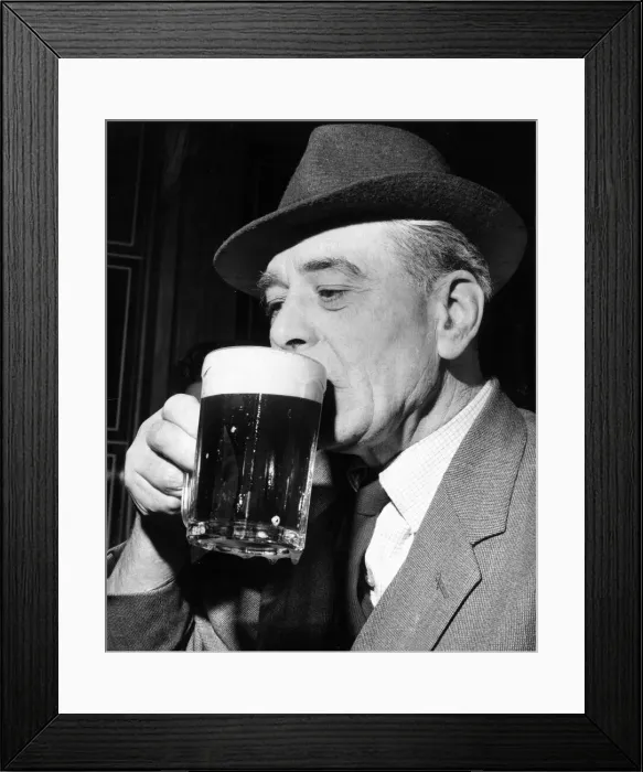 Framed Print : An older gentleman enjoys a refreshing pint at his local pub April 1964 Framed Print : An older gentleman enjoys a refreshing pint at his local pub April 1964