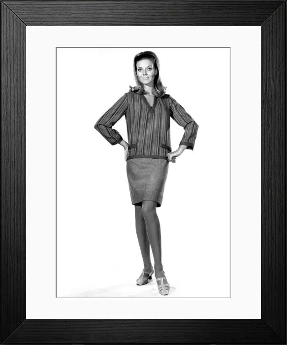 Framed Print : Model Maureen Walker wearing a striped long sleeved top and skirt. November 1968
