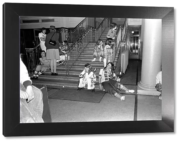 Fans of the Bay City Rollers at their gig in Cardiff take a break on the staircase at