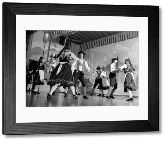 Framed Print : Bavarian couples in traditional dress dancing on stage during a night out in Ruhpolding