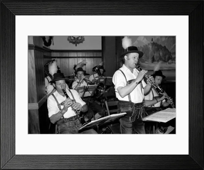 Framed Print : Members of a Bavarian band performing wearing traditional Bavarian dress during a night Framed Print : Members of a Bavarian band performing wearing traditional Bavarian dress during a night