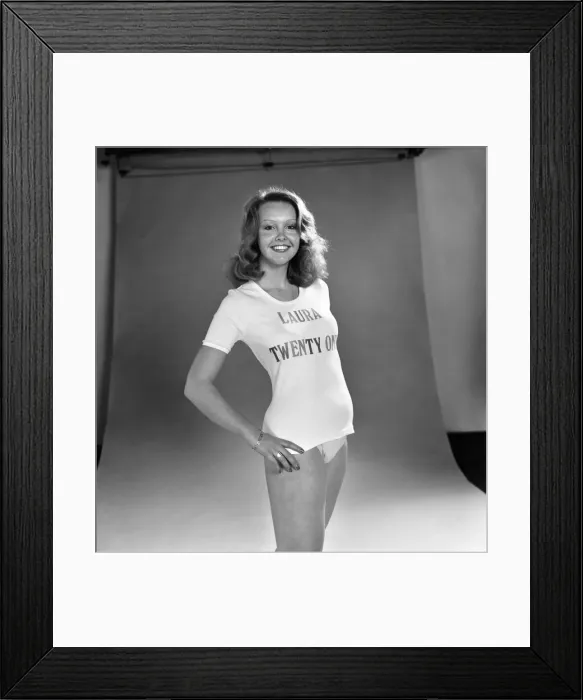 Framed Print : Actress Laura Collins poses wearing a t shirt and pair of knickers in the studio